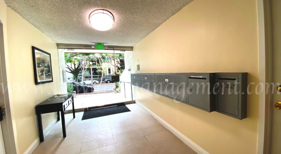 Elegant upper condo with balcony and fireplace walking distance to the beach.