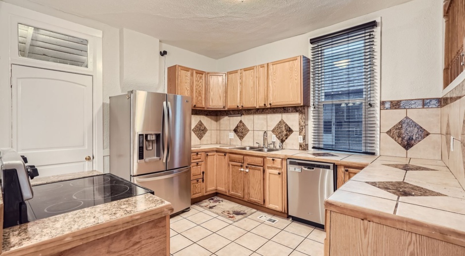 LOCATION! Blocks to Bronco's Stadium, light rail, park, Sloan's Lake.  ALL Utilities Included! Oversized  2 car garage w/workspace & outside RV PARKING!