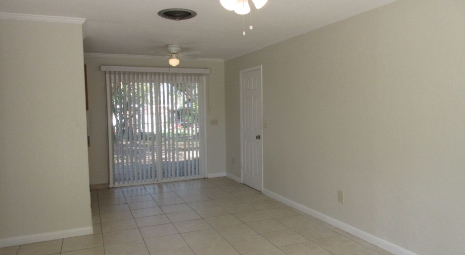 Altamonte 3 bedroom 1 bath home with all tile floors, 1 car garage with laundry area and fenced back yard